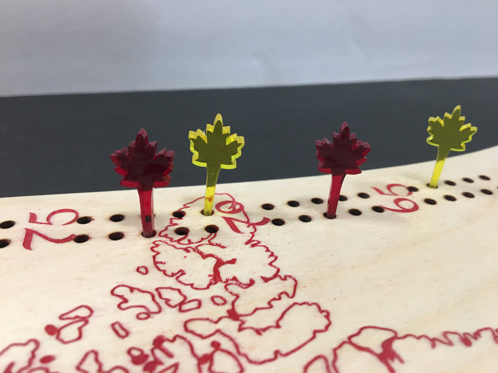 Small decorative items resembling leaves on a textured surface with numbers and patterns.