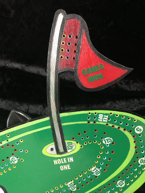 Golf themed cribbage board with acrylic pegs.
