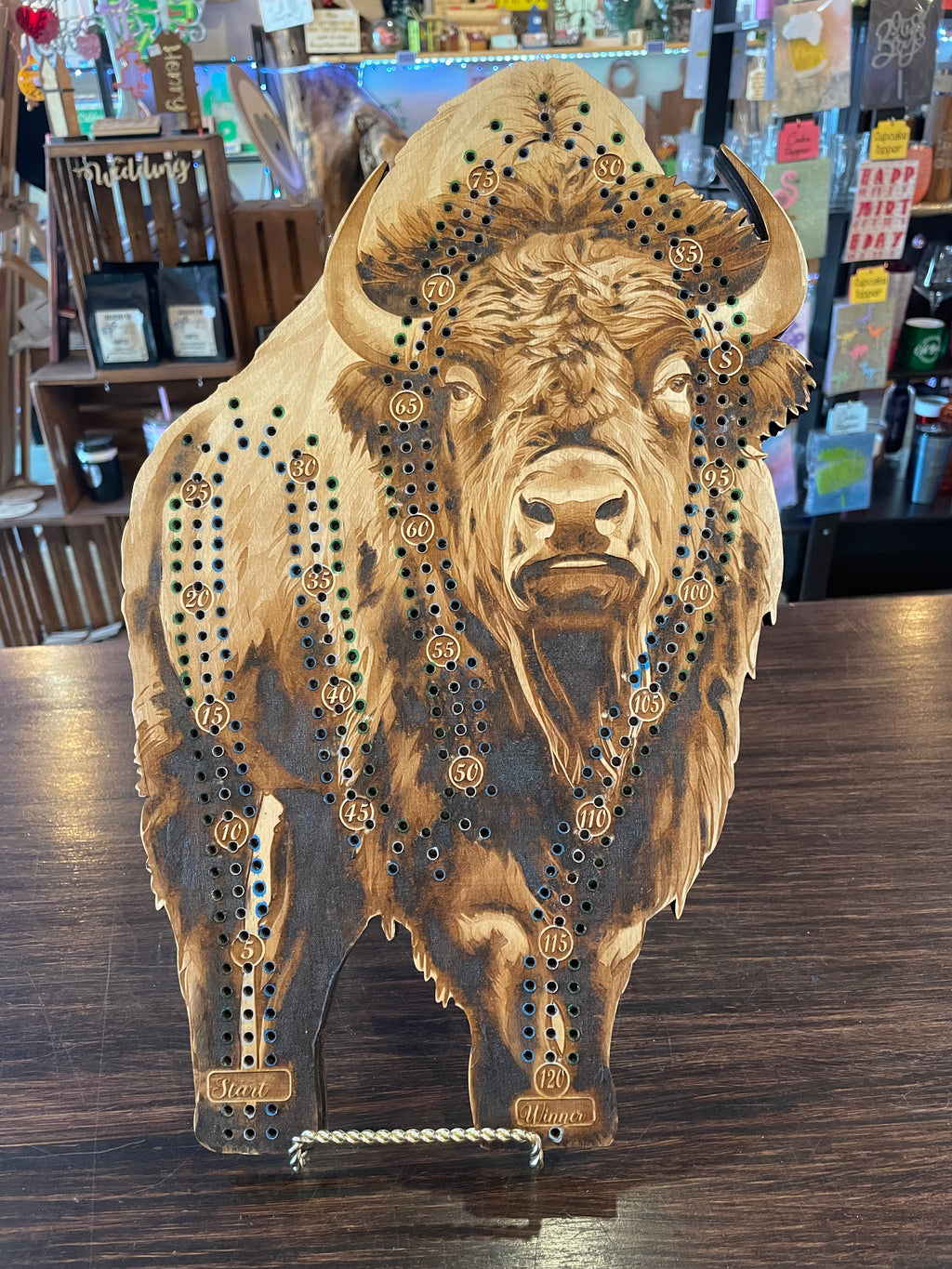 Wooden crib board with buffalo design.