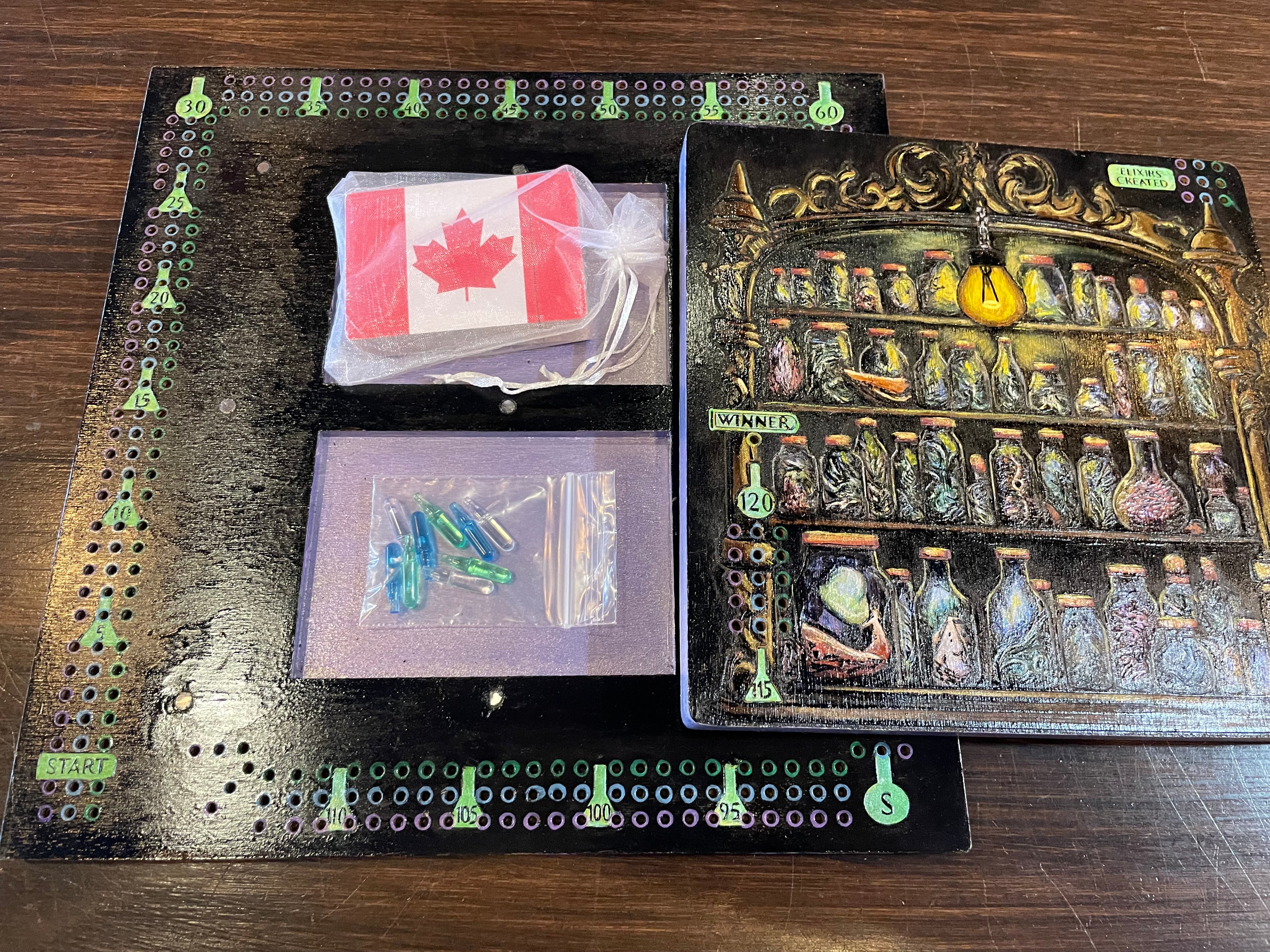 Cribbage Board game components including card and peg holder, and a detailed board with potion bottles.