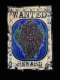 Decorative cribboard with a sasquatch illustration and 'Mandated Reward' text.